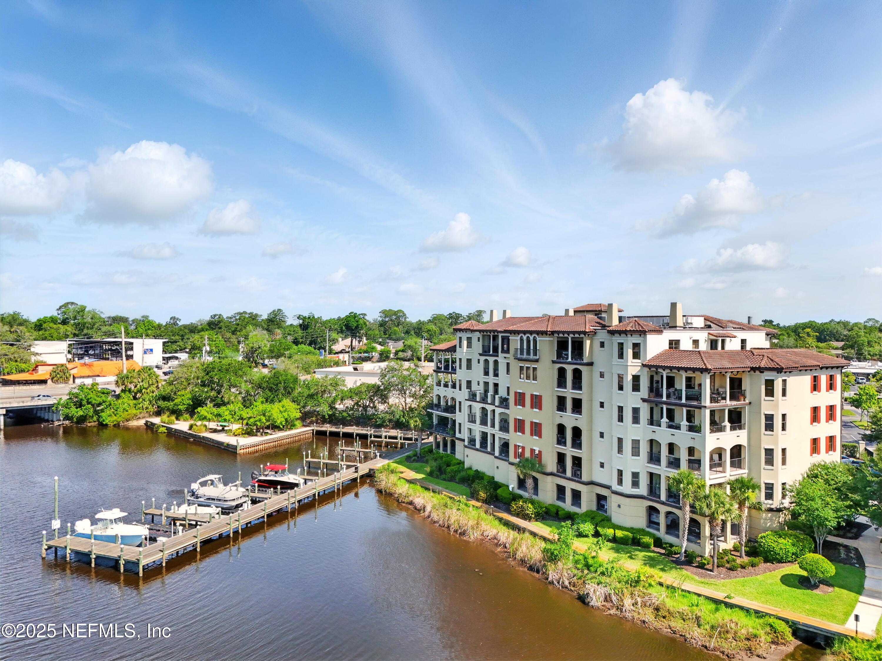 3958 Baymeadows Road, Unit 1602 Jacksonville, FL 32217 - Photo 2 of 89 a view of a lake with a multi story building in front of it
