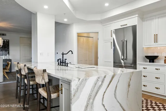 a spacious bathroom with a double vanity sink and a mirror