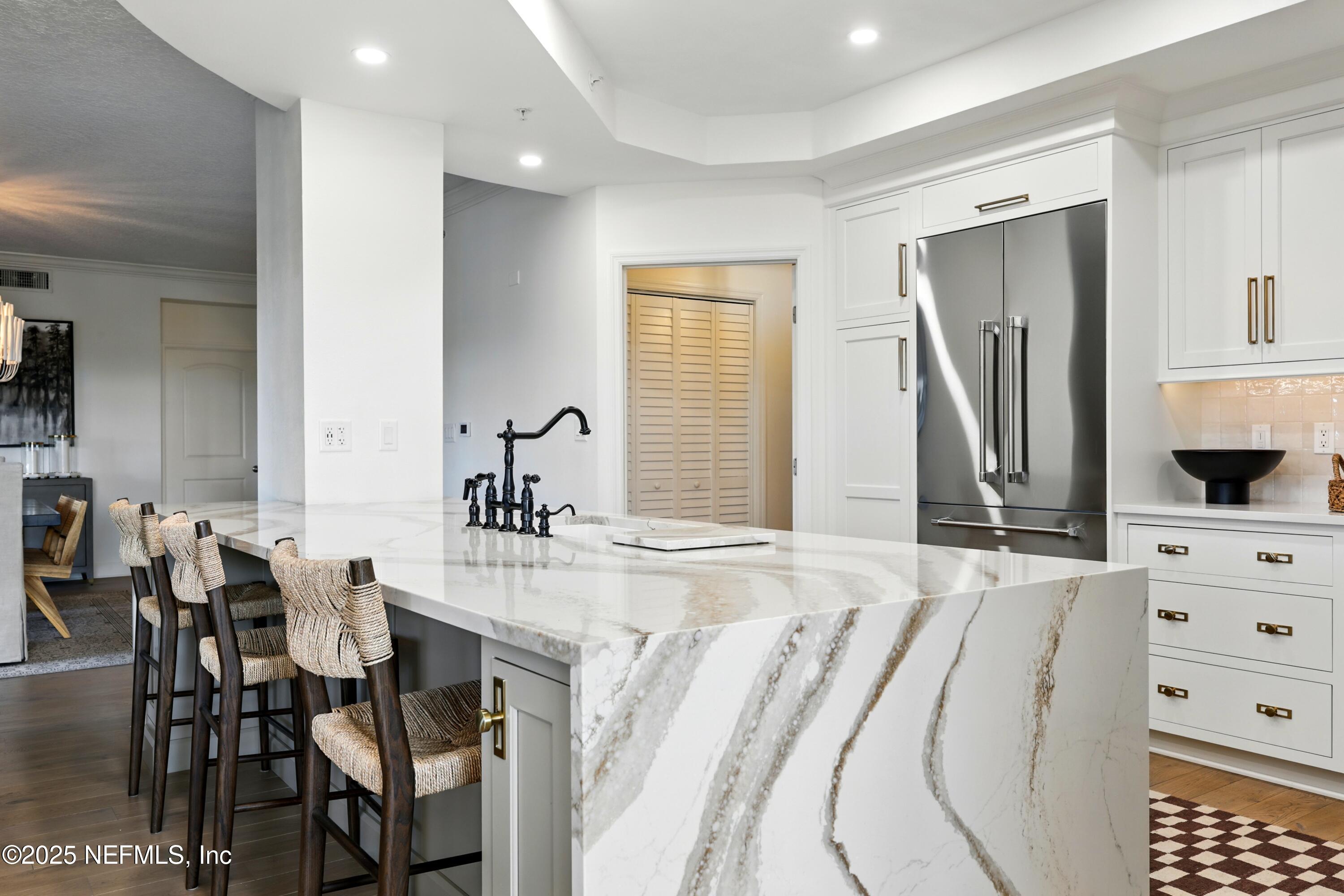 3958 Baymeadows Road, Unit 1602 Jacksonville, FL 32217 - Photo 21 of 89 a spacious bedroom with a bed a table and chair