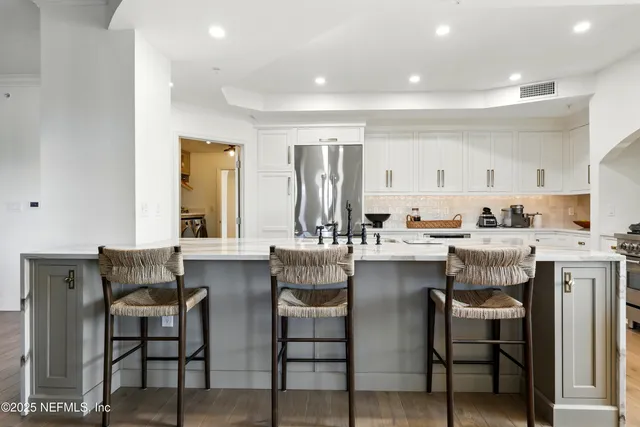 a bedroom with a bed and a chair