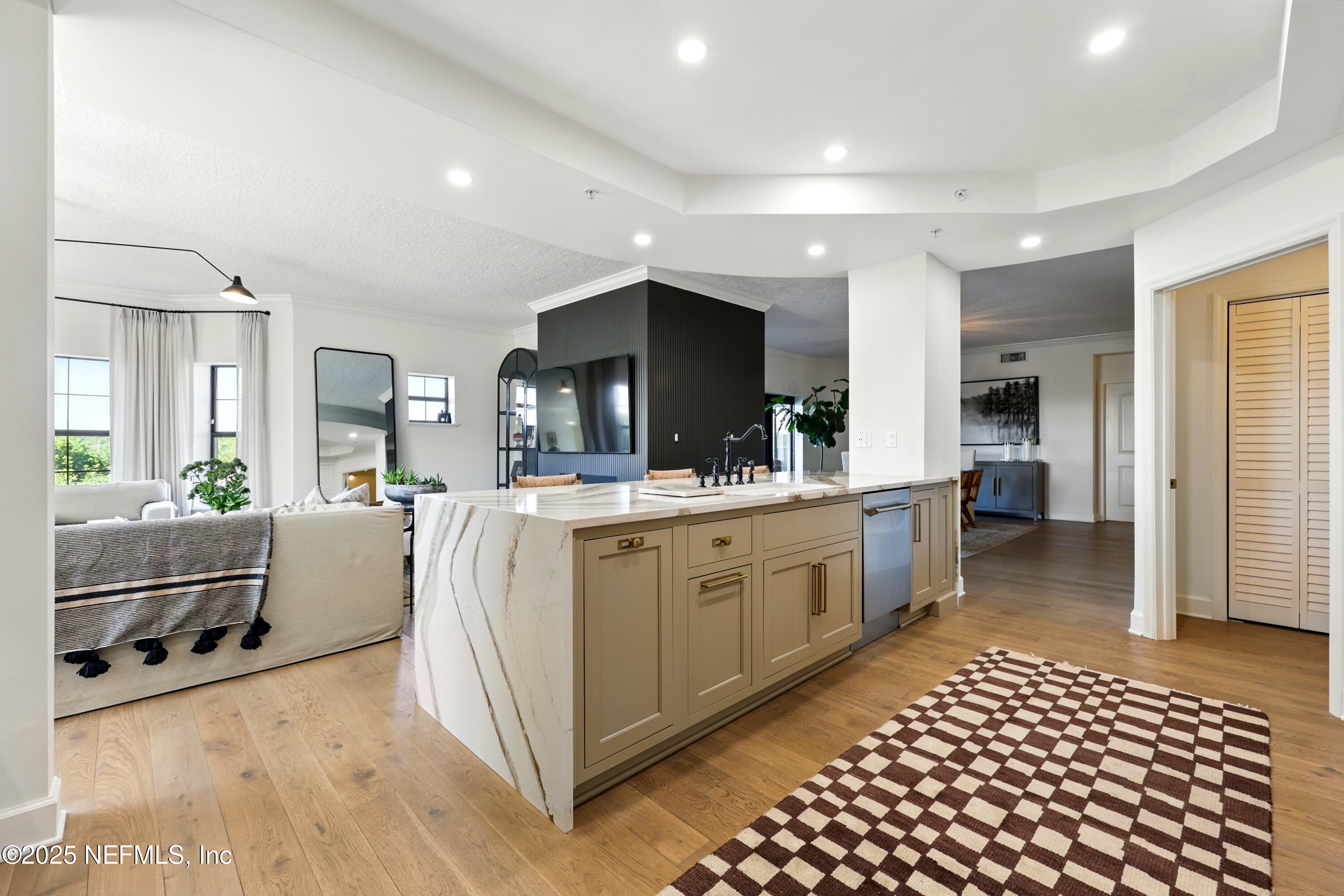 3958 Baymeadows Road, Unit 1602 Jacksonville, FL 32217 - Photo 25 of 89 a large white kitchen with a large window and stainless steel appliances