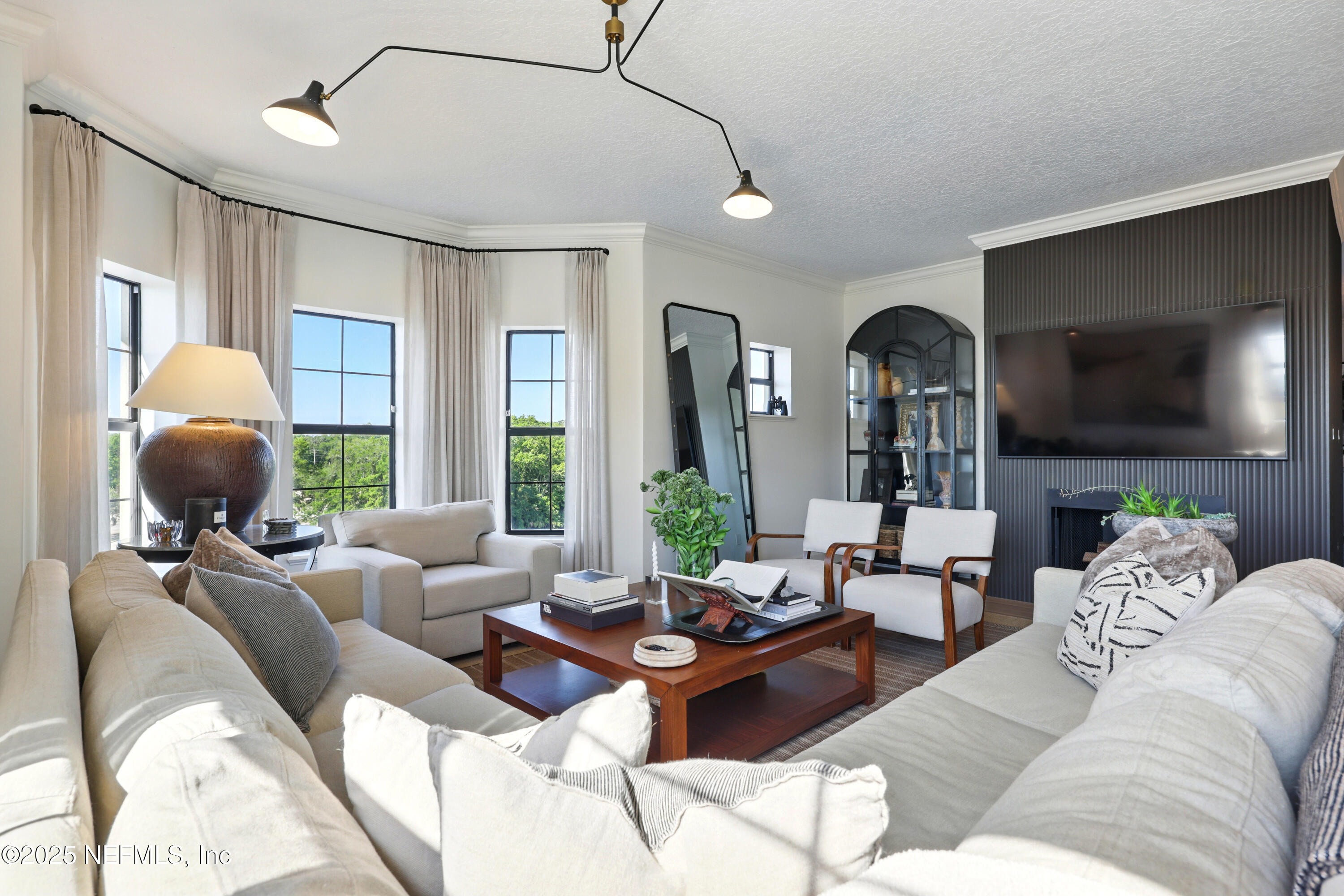 3958 Baymeadows Road, Unit 1602 Jacksonville, FL 32217 - Photo 26 of 89 a living room with furniture and a flat screen tv