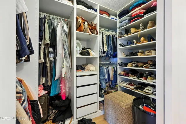 an aerial view of a house with a lake view