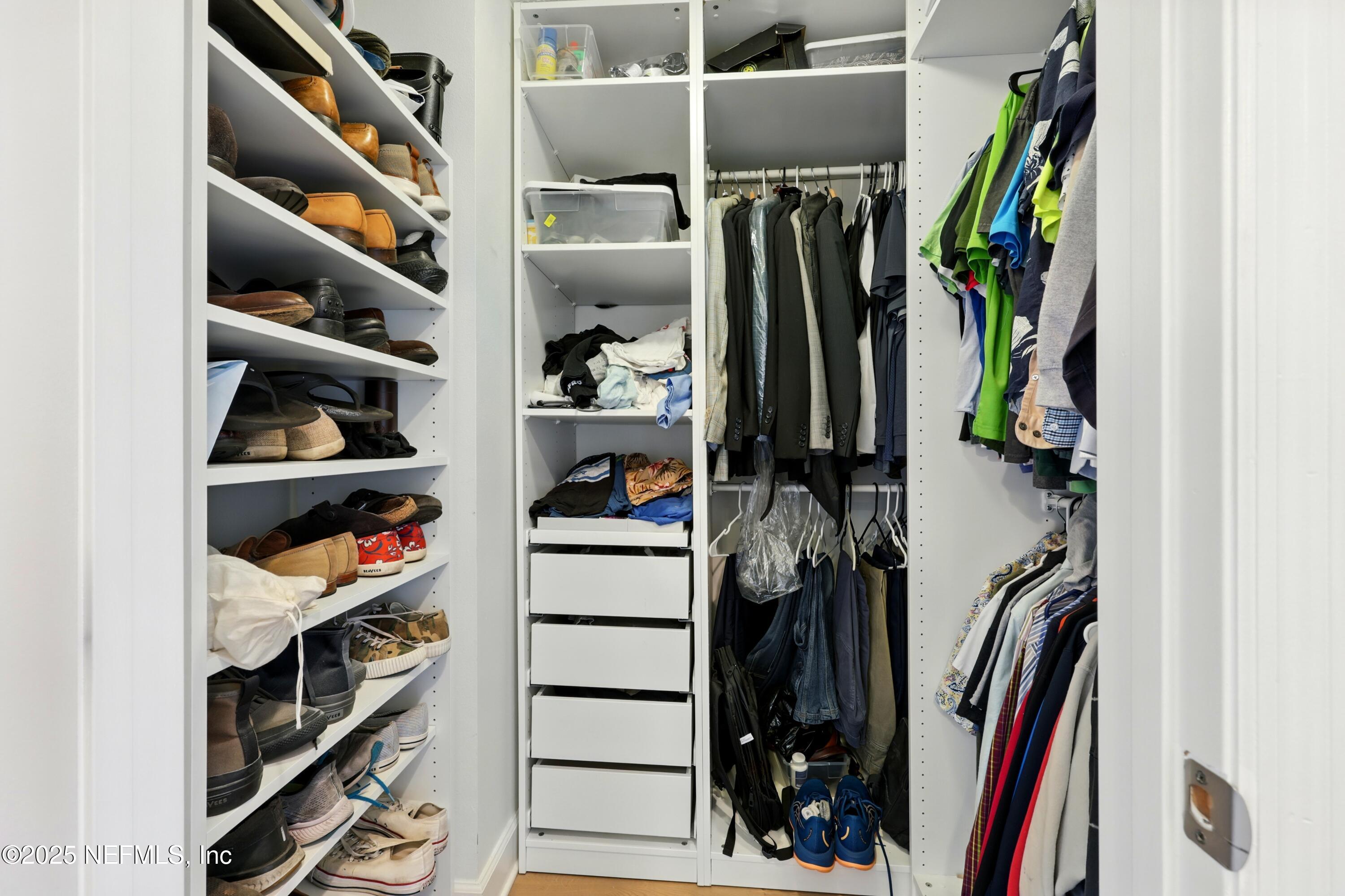 3958 Baymeadows Road, Unit 1602 Jacksonville, FL 32217 - Photo 33 of 89 a view of walk in closet with clothes and shoes
