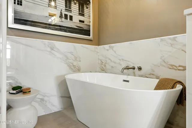 an aerial view of a house with a lake view