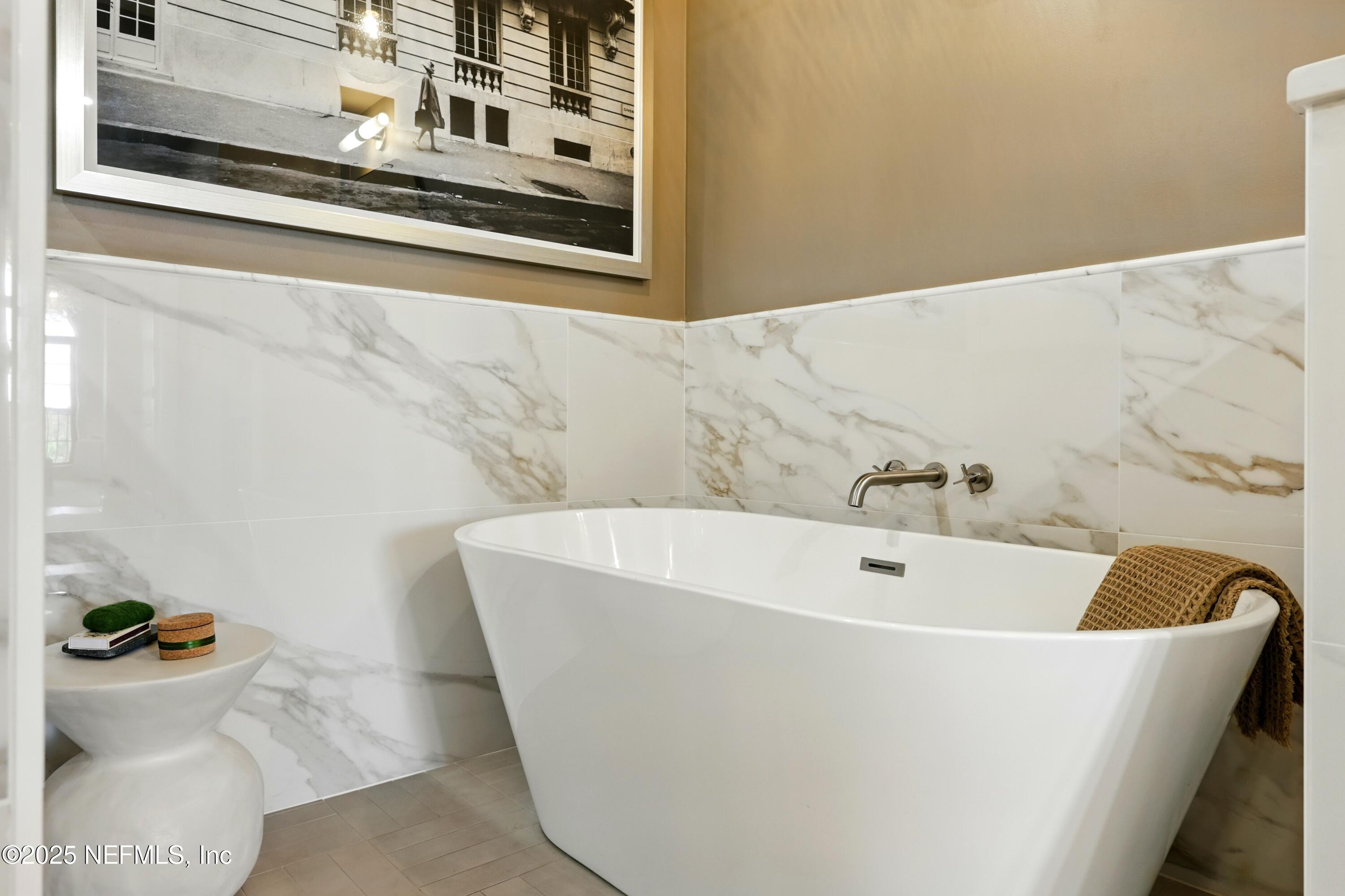 3958 Baymeadows Road, Unit 1602 Jacksonville, FL 32217 - Photo 35 of 89 a white bath tub sitting in a bathroom