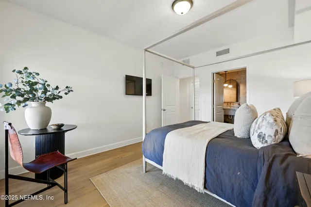 a front view of a residential apartment building with a yard