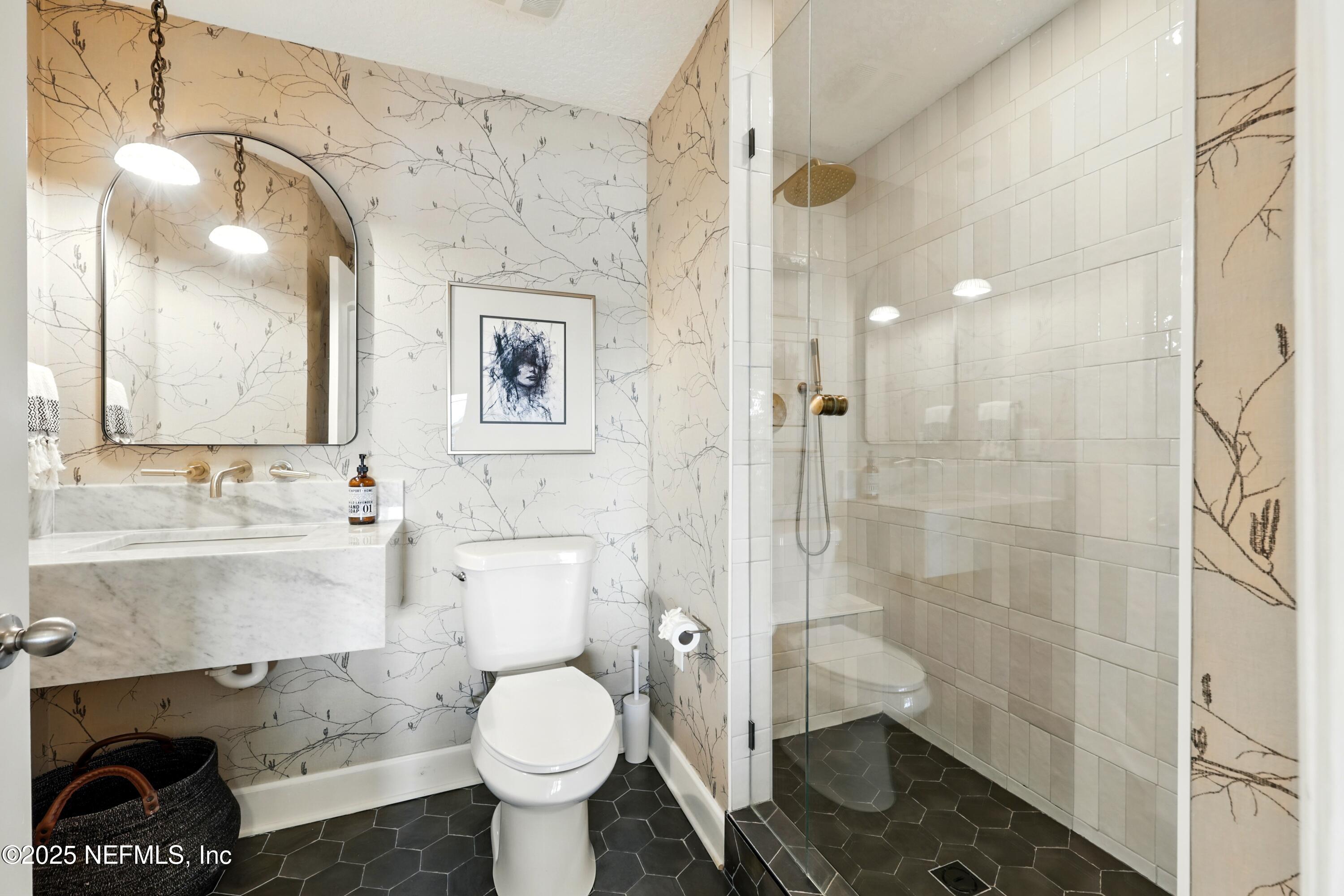 3958 Baymeadows Road, Unit 1602 Jacksonville, FL 32217 - Photo 39 of 89 a bathroom with a sink toilet and shower