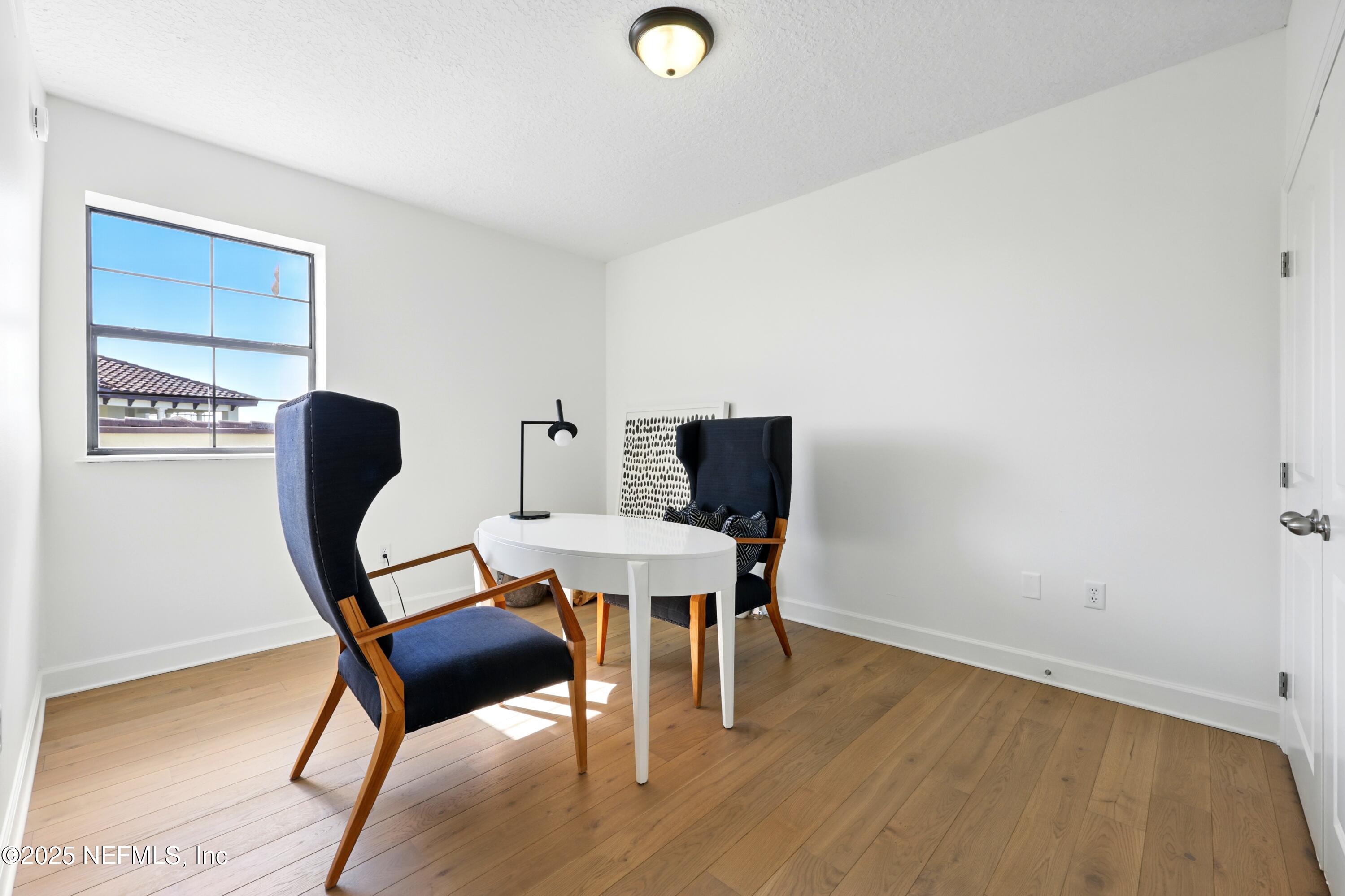 3958 Baymeadows Road, Unit 1602 Jacksonville, FL 32217 - Photo 40 of 89 a view of a workspace with furniture and wooden floor