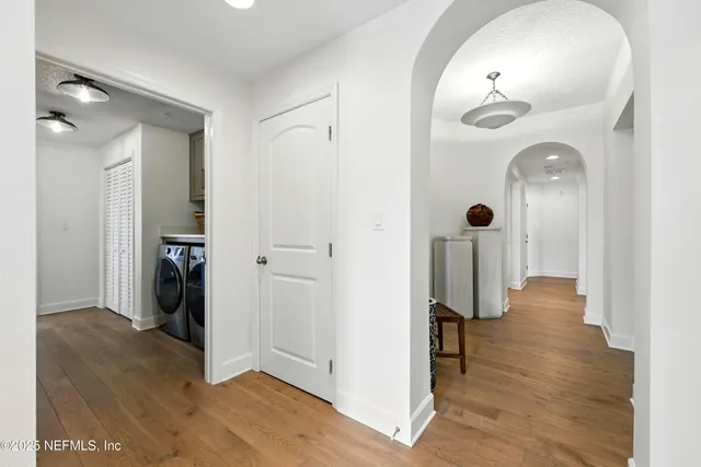 a view of a lake with boats and trees in the background