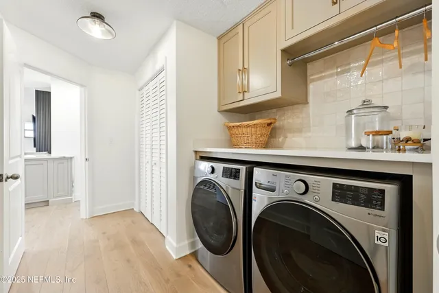 a view of swimming pool with outdoor seating and house in the background