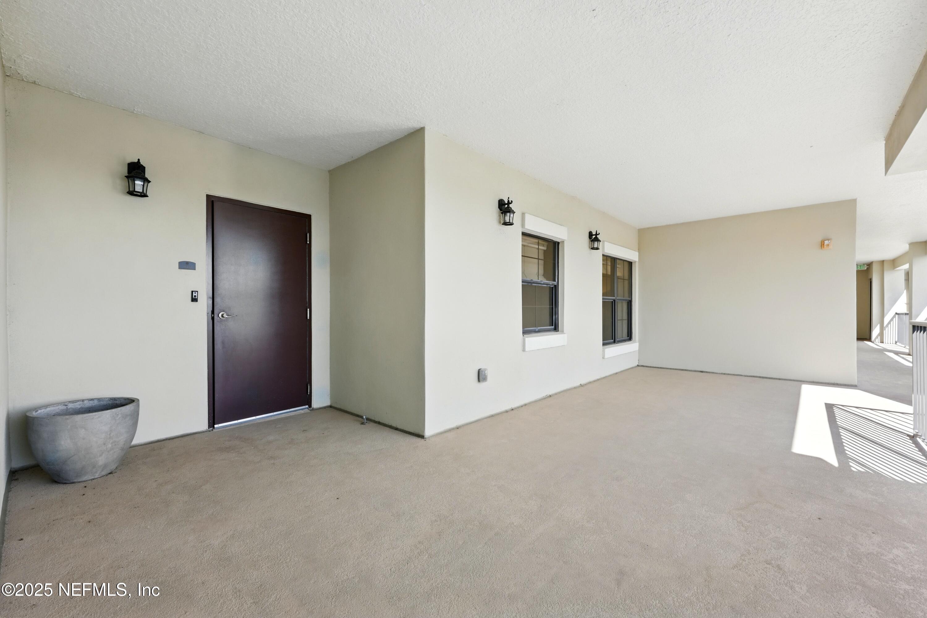 3958 Baymeadows Road, Unit 1602 Jacksonville, FL 32217 - Photo 49 of 89 a view of an empty room with a window
