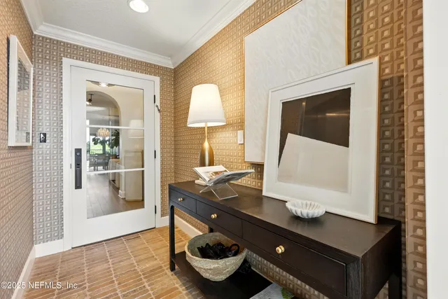 a living room with furniture a fireplace and a large mirror