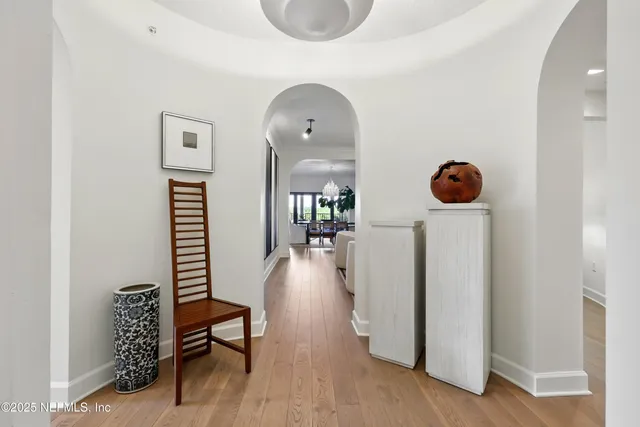 a view of a dining room with furniture wooden floor and chandelier