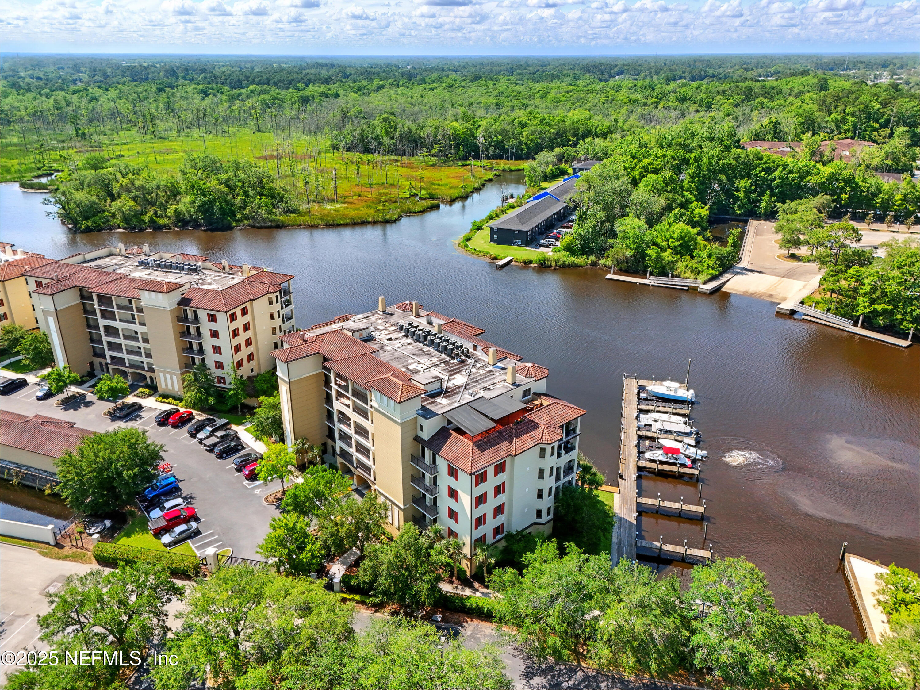 3958 Baymeadows Road, Unit 1602 Jacksonville, FL 32217 - Photo 66 of 89 an aerial view of a house with a yard and lake view