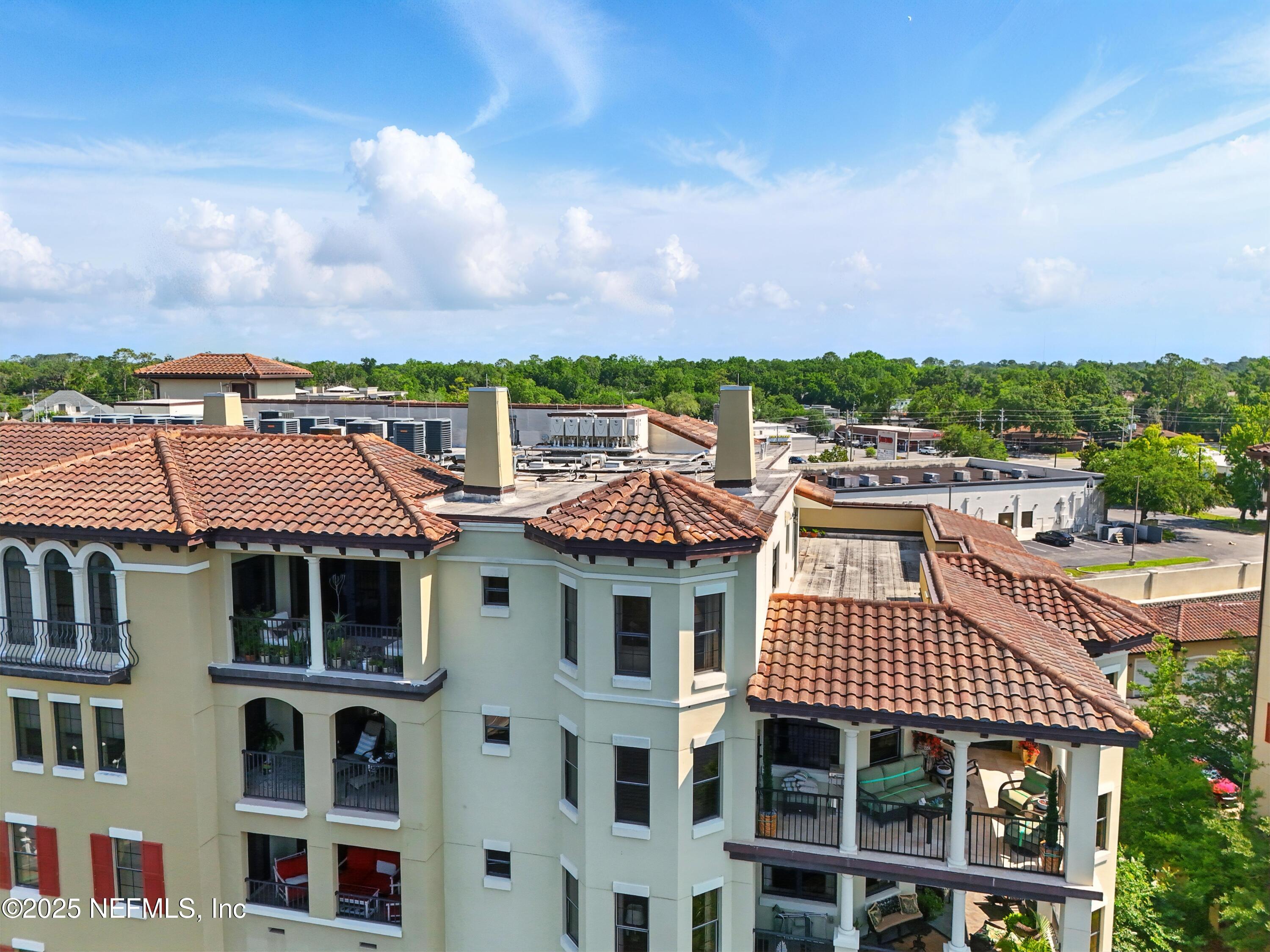 3958 Baymeadows Road, Unit 1602 Jacksonville, FL 32217 - Photo 68 of 89 a front view of a residential apartment building with a yard