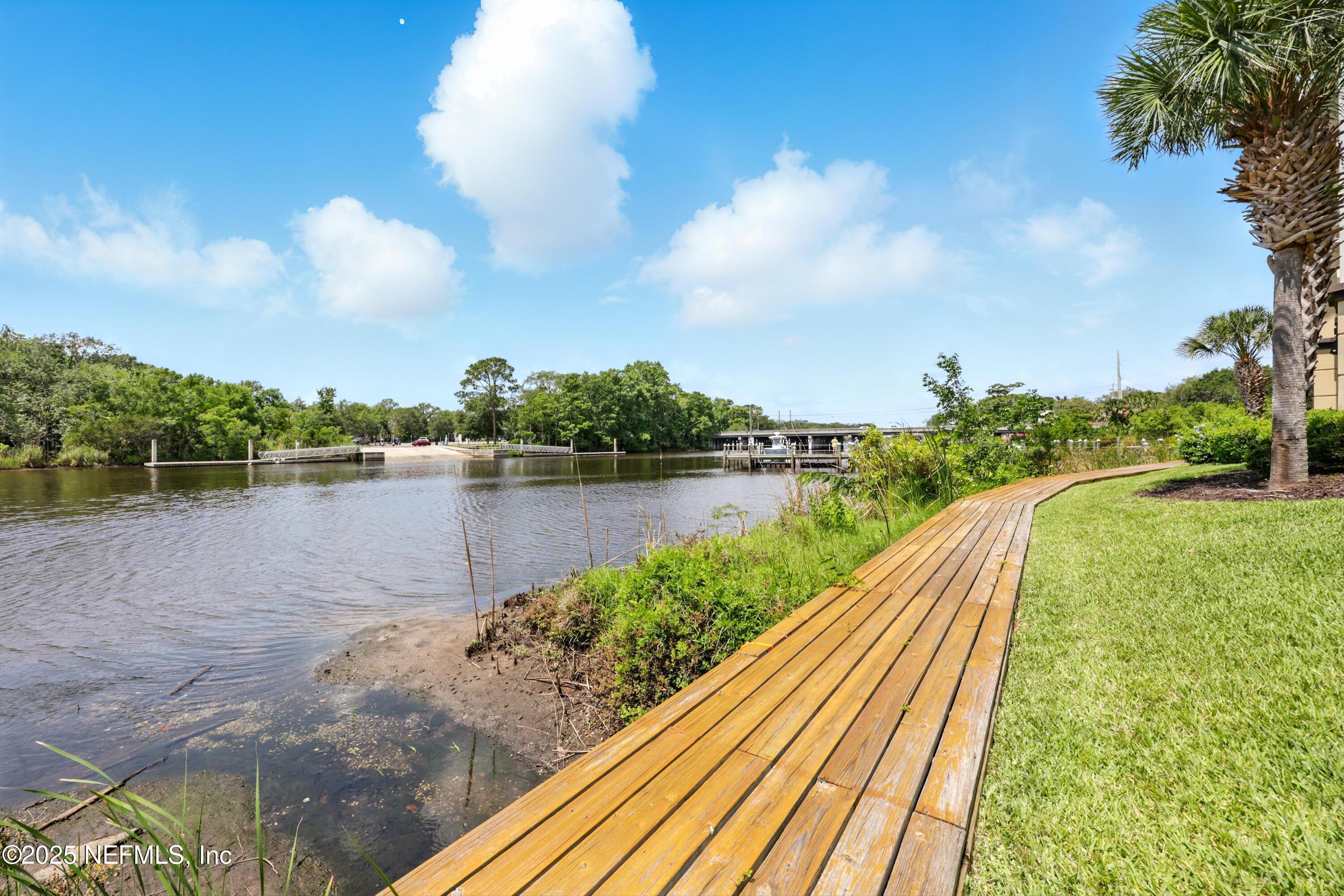 3958 Baymeadows Road, Unit 1602 Jacksonville, FL 32217 - Photo 72 of 89 a view of a lake with a yard