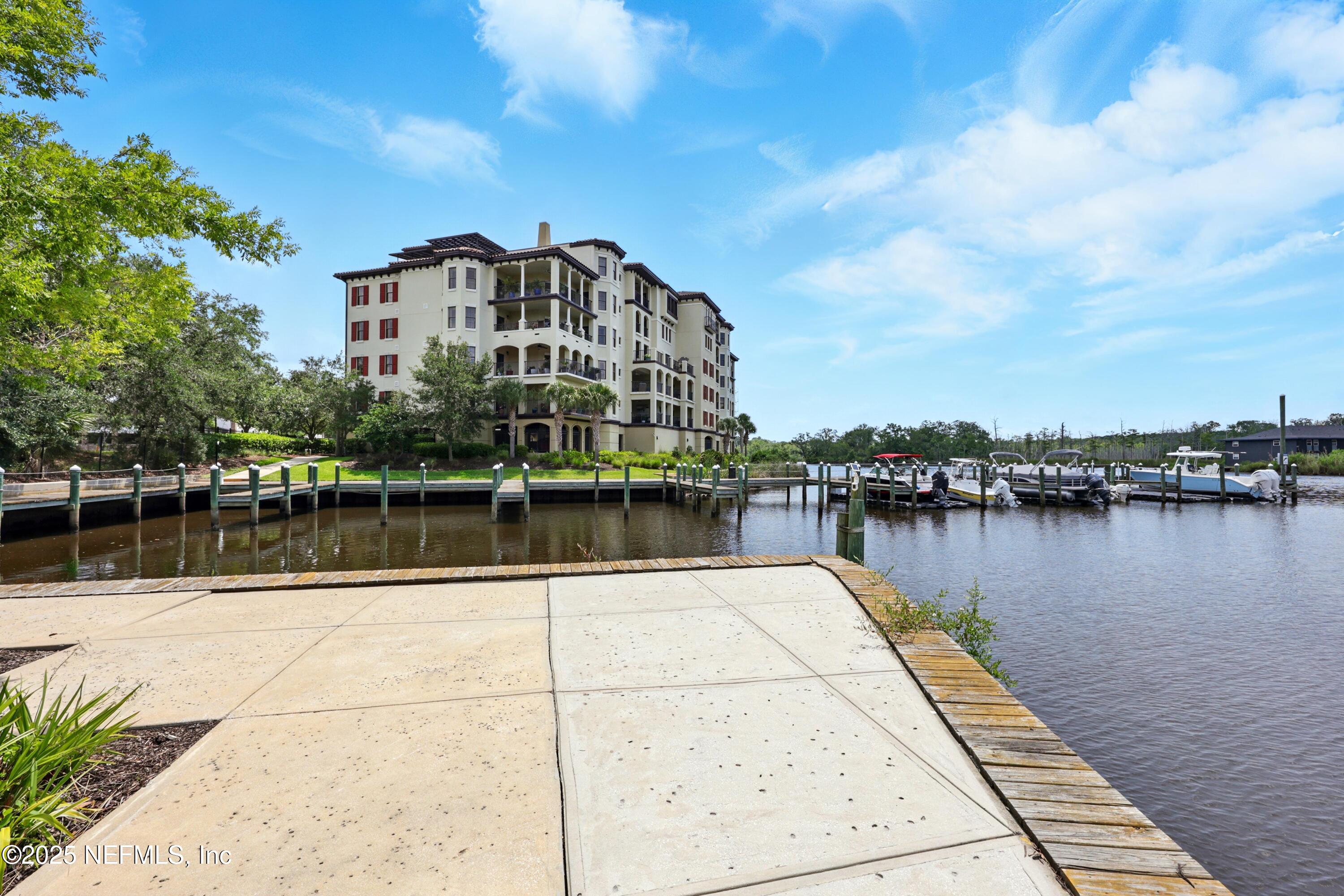 3958 Baymeadows Road, Unit 1602 Jacksonville, FL 32217 - Photo 77 of 89 a view of a lake with boats and trees in the background