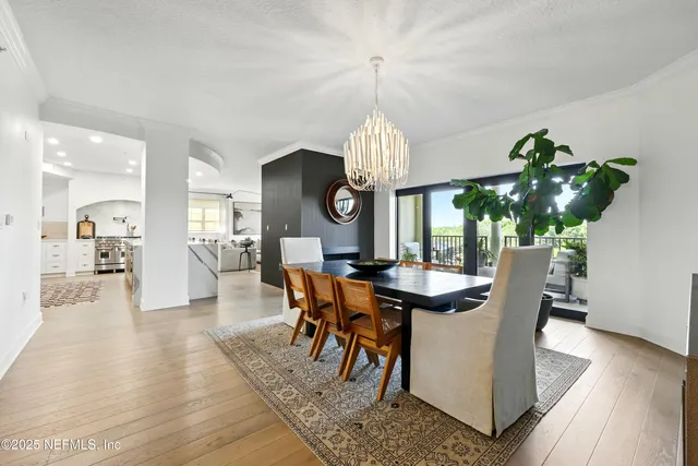 a kitchen with stainless steel appliances a refrigerator and a stove top oven