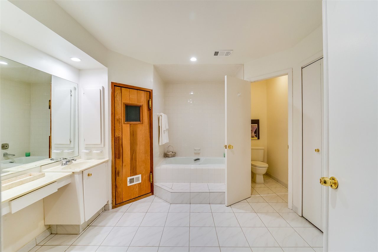 70 Harbor Key Road Secaucus, NJ 07094 - Photo 11 of 15 a spacious bathroom with a tub shower and mirror