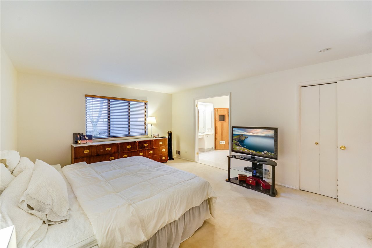 70 Harbor Key Road Secaucus, NJ 07094 - Photo 9 of 15 a bedroom with a bed and a flat screen tv