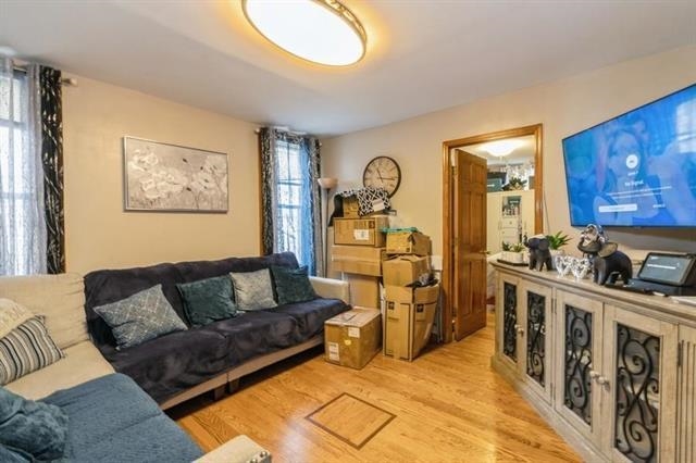 1012 Paterson Plank Road, Unit 1 North Bergen, NJ 07047 - Photo 4 of 13 a living room with furniture and wooden floor
