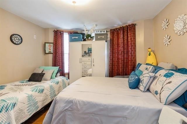 1012 Paterson Plank Road, Unit 1 North Bergen, NJ 07047 - Photo 5 of 13 a bedroom with a bed and a closet