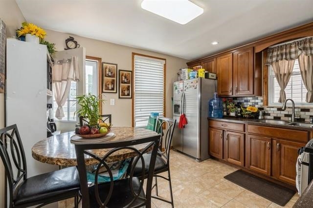 1012 Paterson Plank Road, Unit 1 North Bergen, NJ 07047 - Photo 8 of 13 a dining room with furniture and window