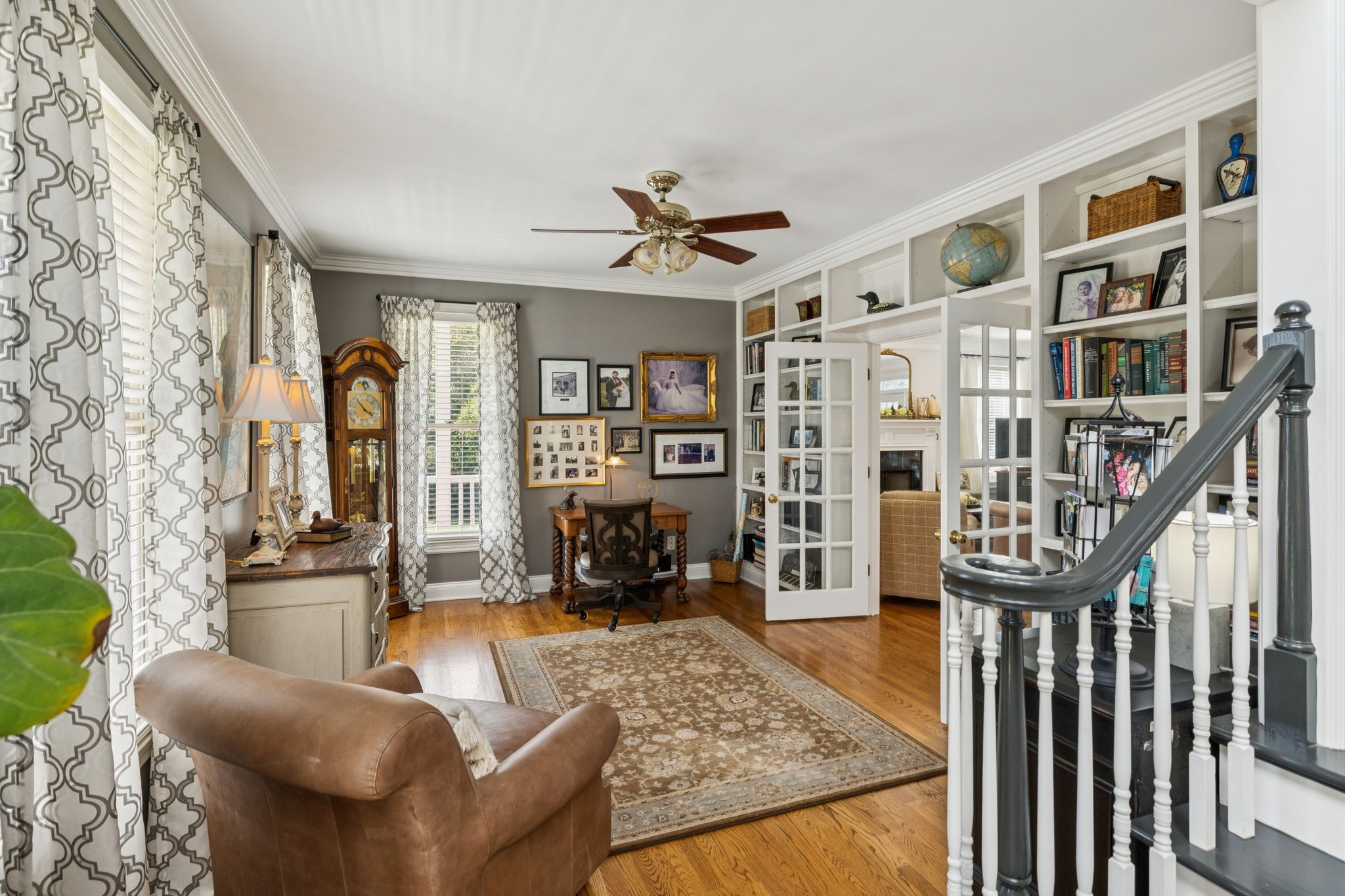 1909 Dr Robinson Rd Spring Hill Thompson's Station, TN 37179 - Photo 16 of 72 a living room with furniture a rug and a chandelier