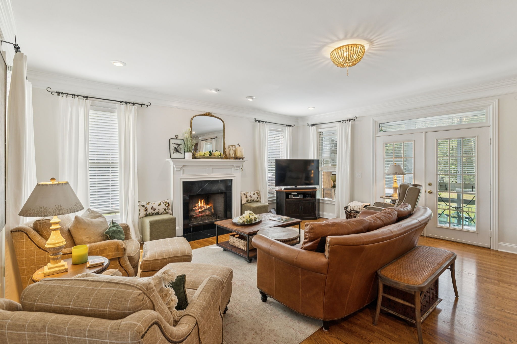 1909 Dr Robinson Rd Spring Hill Thompson's Station, TN 37179 - Photo 23 of 72 a living room with furniture and a fireplace