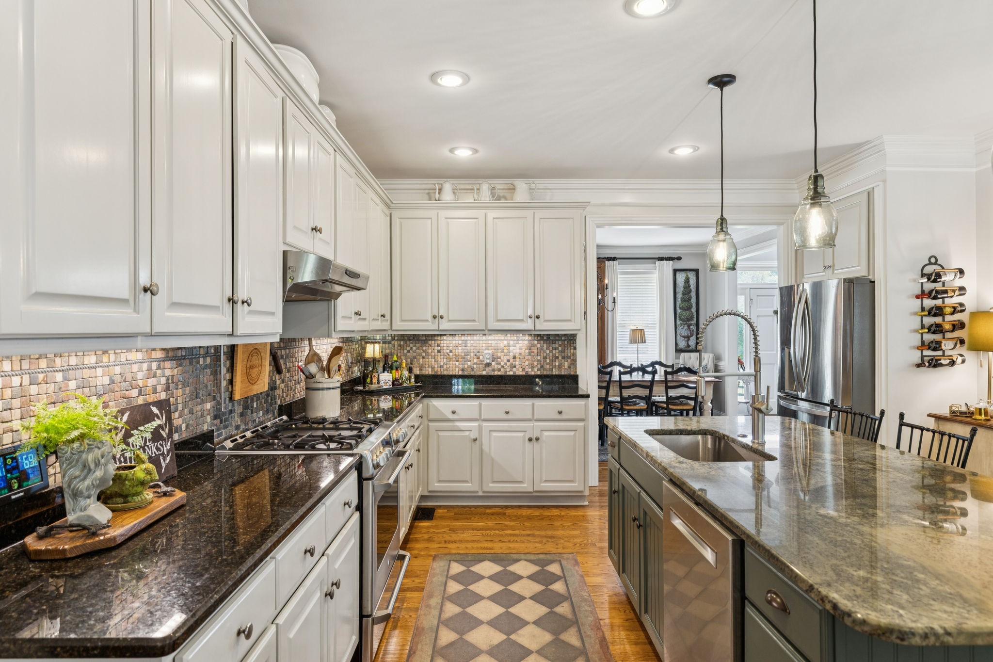 1909 Dr Robinson Rd Spring Hill Thompson's Station, TN 37179 - Photo 26 of 72 a kitchen with stainless steel appliances granite countertop a sink stove and refrigerator