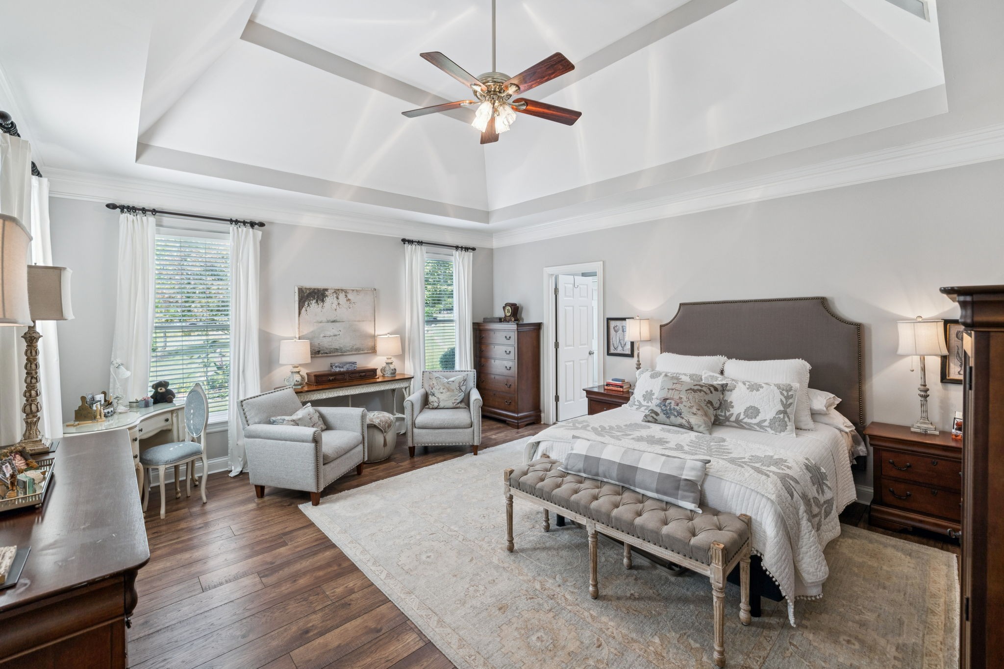 1909 Dr Robinson Rd Spring Hill Thompson's Station, TN 37179 - Photo 35 of 72 a spacious bedroom with a bed a couch and a chandelier