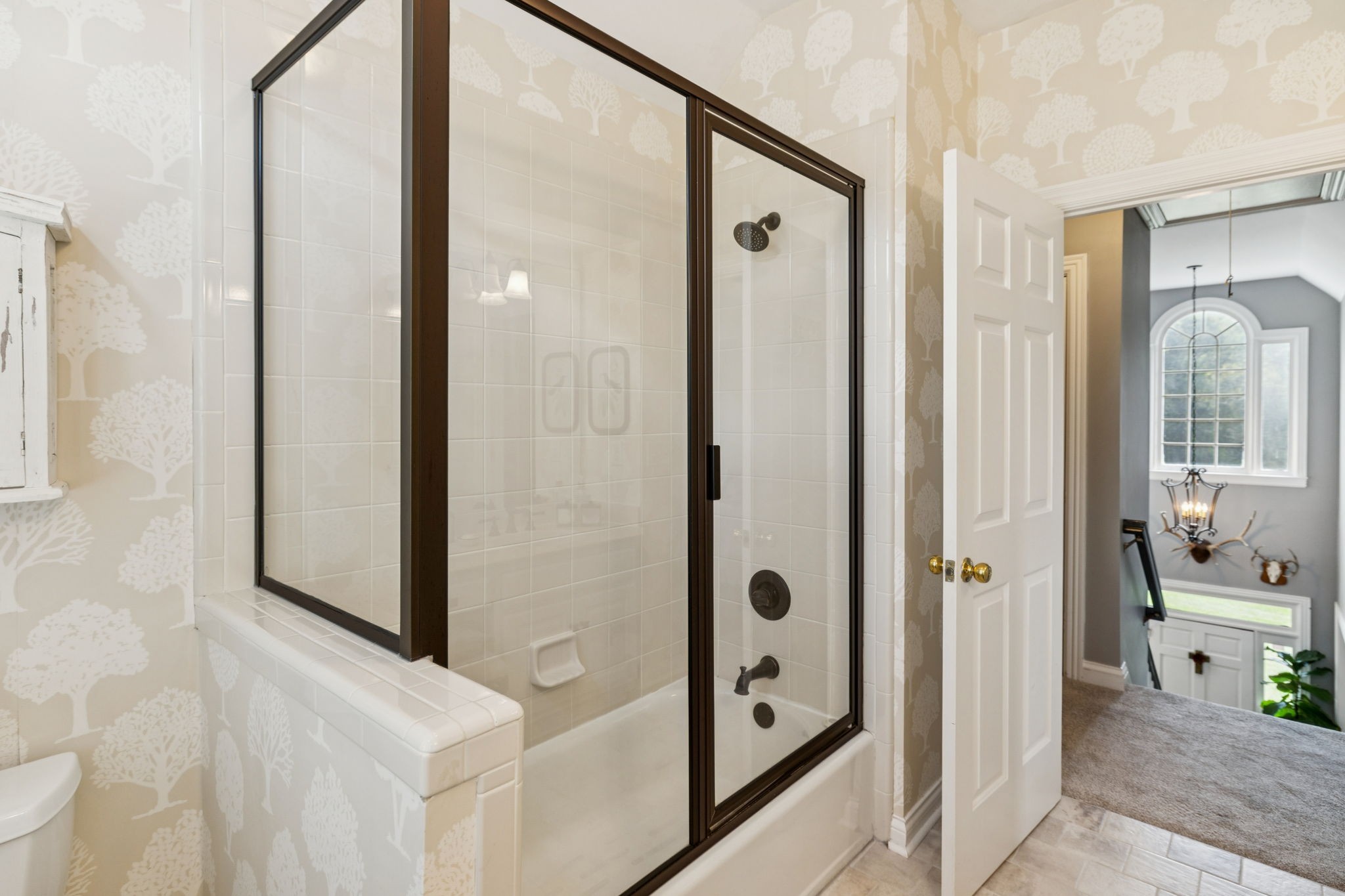 1909 Dr Robinson Rd Spring Hill Thompson's Station, TN 37179 - Photo 39 of 72 a bathroom with a glass shower door and a glass door