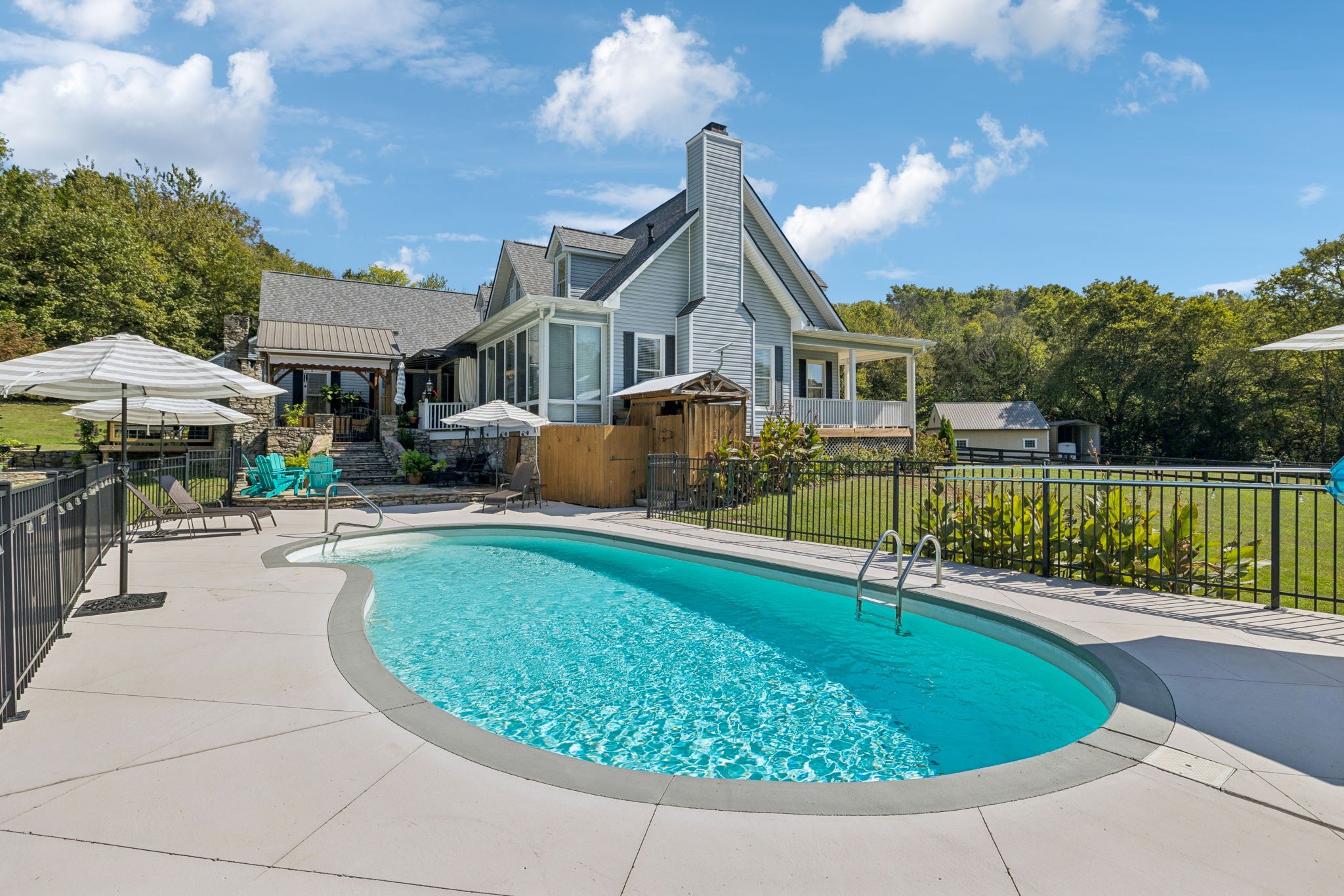 1909 Dr Robinson Rd Spring Hill Thompson's Station, TN 37179 - Photo 58 of 72 a view of a house with swimming pool and sitting area