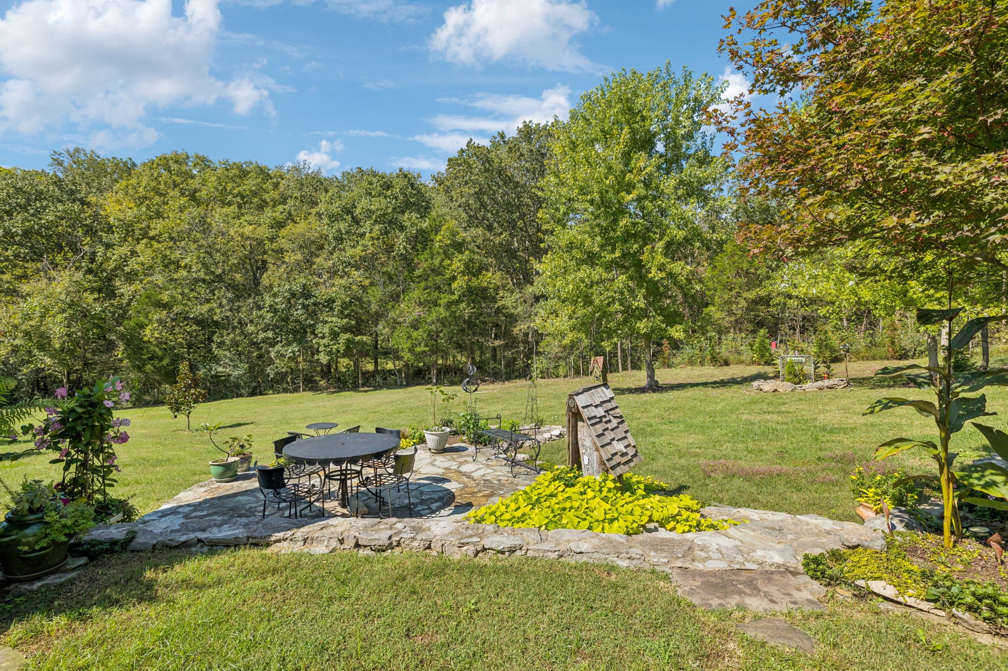 1909 Dr Robinson Rd Spring Hill Thompson's Station, TN 37179 - Photo 62 of 72 a view of a garden with an outdoor space