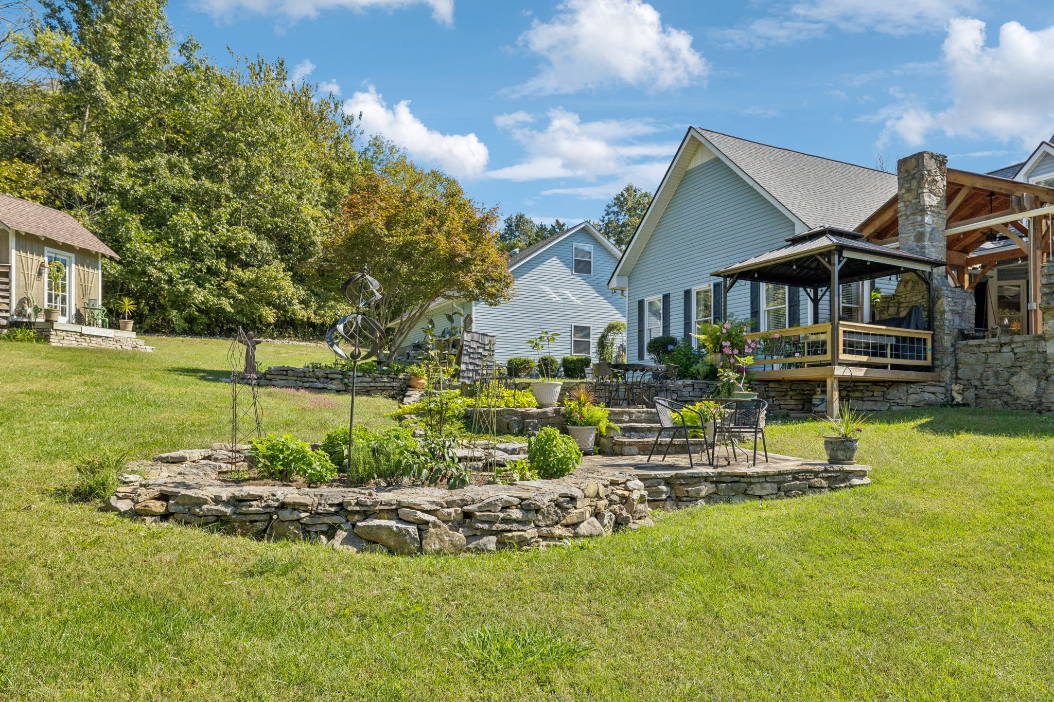 1909 Dr Robinson Rd Spring Hill Thompson's Station, TN 37179 - Photo 65 of 72 a view of a house with a big yard potted plants and large tree