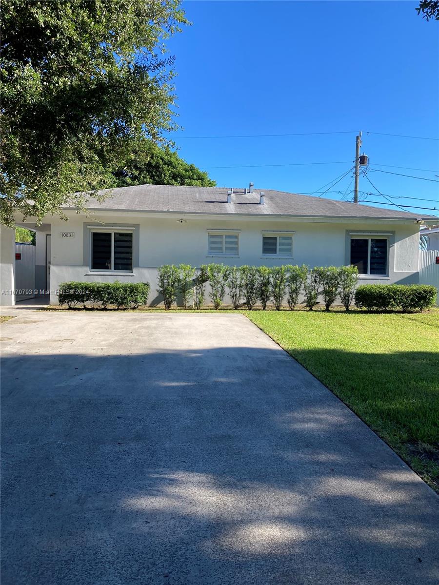 10831 West Old Cutler Road Miami, FL 33170 - Photo 1 of 14 a front view of house with yard and green space