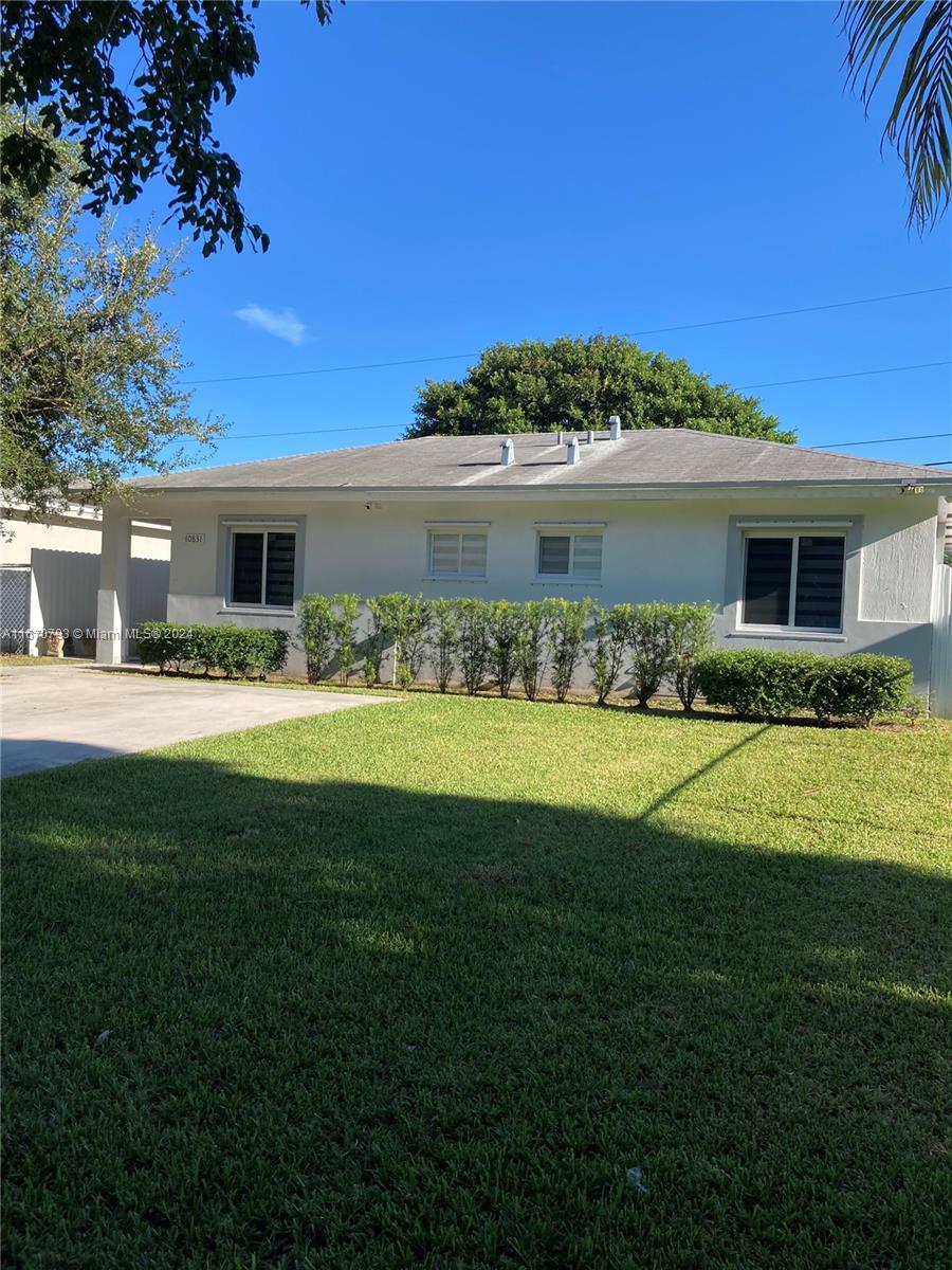 10831 West Old Cutler Road Miami, FL 33170 - Photo 2 of 14 a front view of house with yard and green space