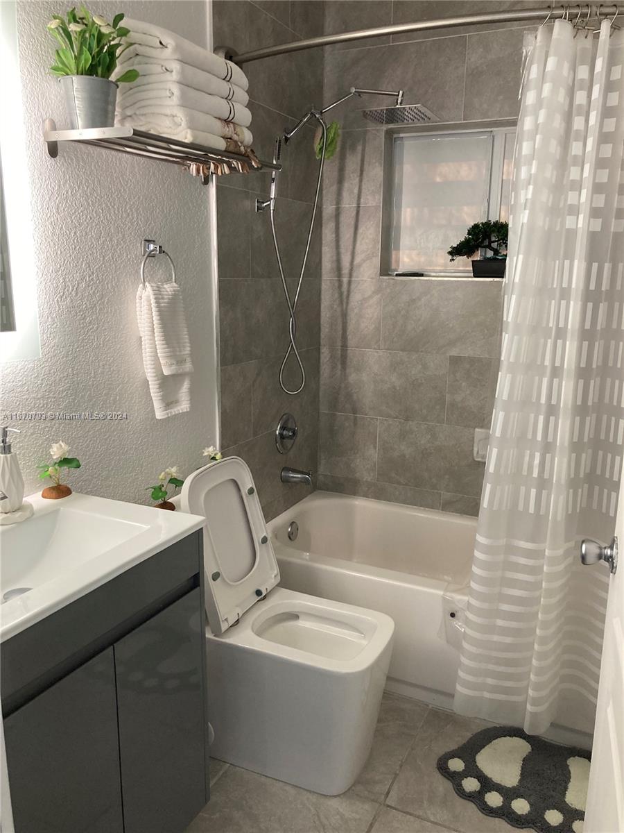 10831 West Old Cutler Road Miami, FL 33170 - Photo 6 of 14 a bathroom with a sink toilet and shower