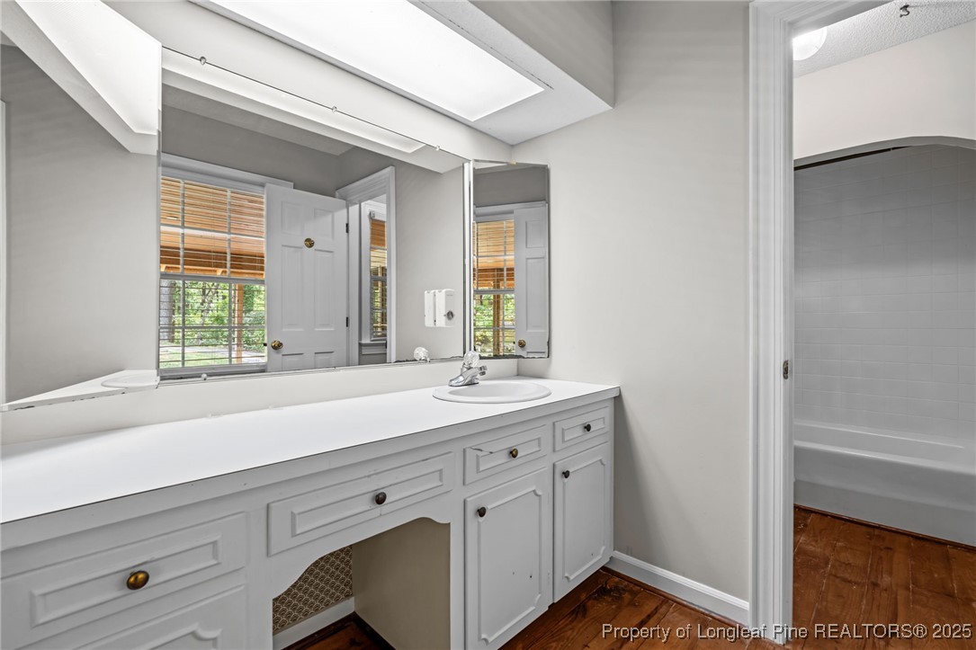 610 Maynard Lake Road Erwin, NC 28339 - Photo 19 of 49 a bathroom with a sink and a window