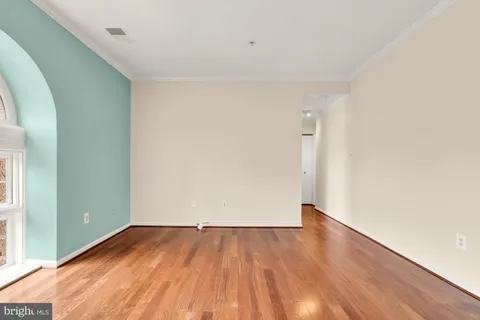 an empty room with wooden floor