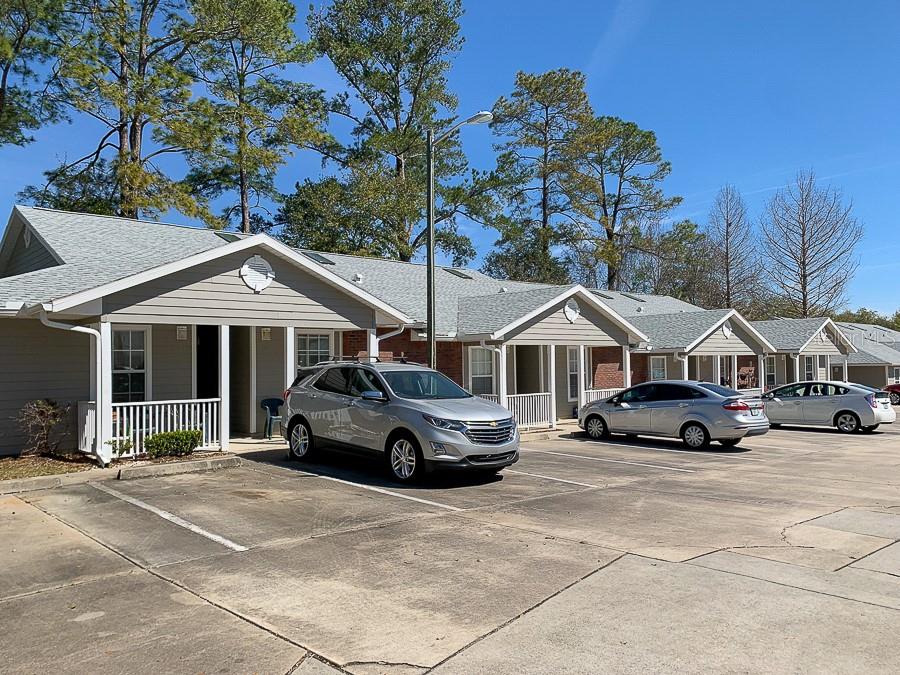 4014 Southwest 26th Drive, Unit 27 Gainesville, FL 32608 - Photo 1 of 15 a car parked in front of a house
