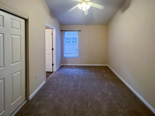 an empty room with a empty space and a window