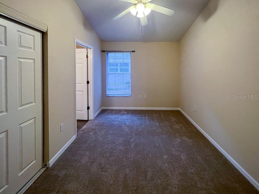 4014 Southwest 26th Drive, Unit 27 Gainesville, FL 32608 - Photo 11 of 15 an empty room with a empty space and a window