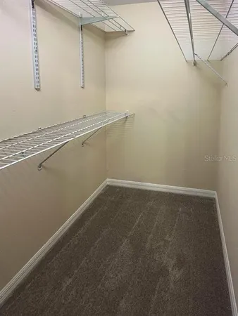 a view of a room with racks on the wall