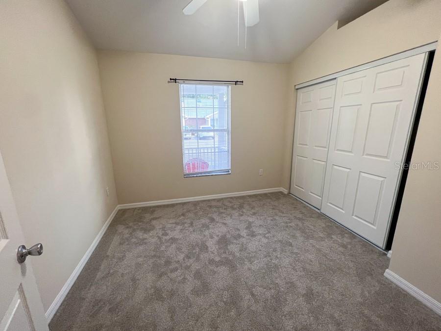 4014 Southwest 26th Drive, Unit 27 Gainesville, FL 32608 - Photo 2 of 15 an empty room with windows