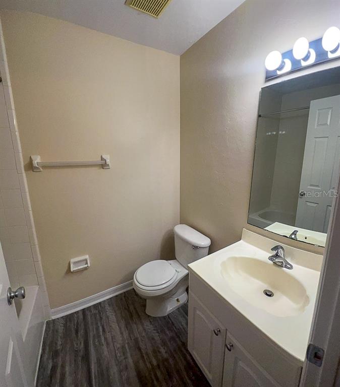 4014 Southwest 26th Drive, Unit 27 Gainesville, FL 32608 - Photo 3 of 15 a bathroom with a sink and a mirror