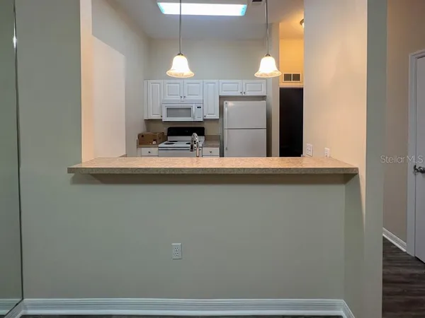 a view of a kitchen with a sink