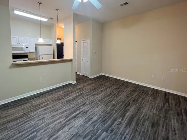 a view of a kitchen from the hallway