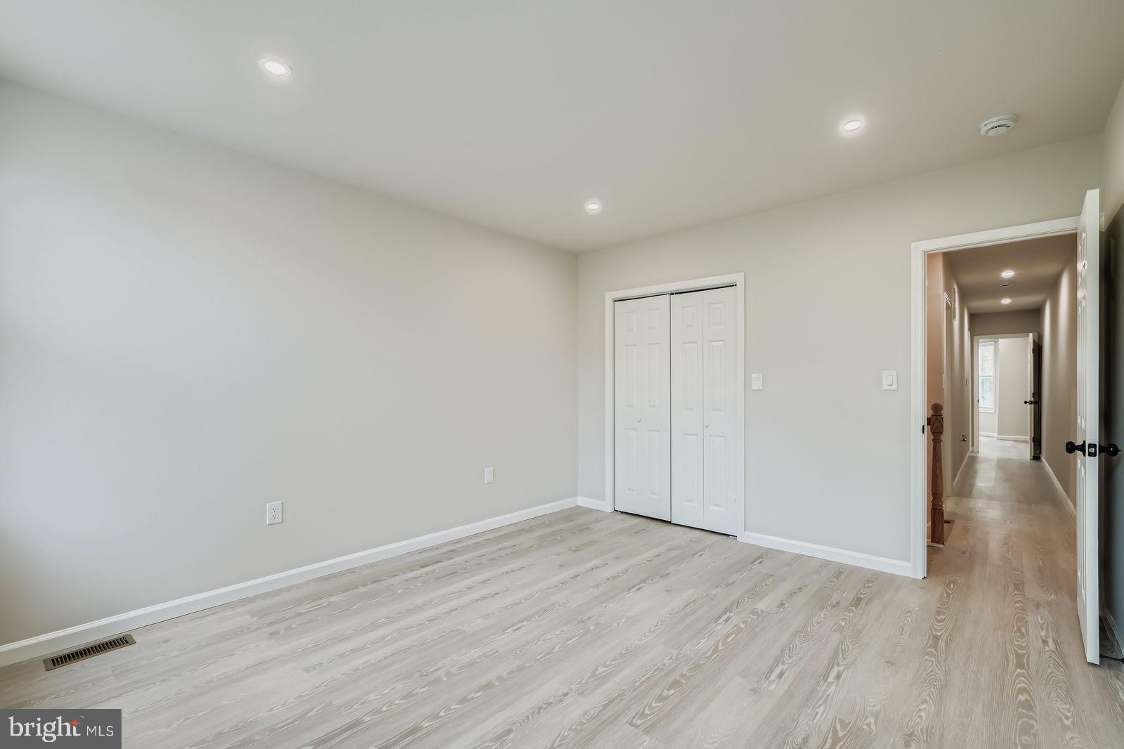 1729 North Fulton Avenue Baltimore, MD 21217 - Photo 14 of 30 a view of empty room with wooden floor